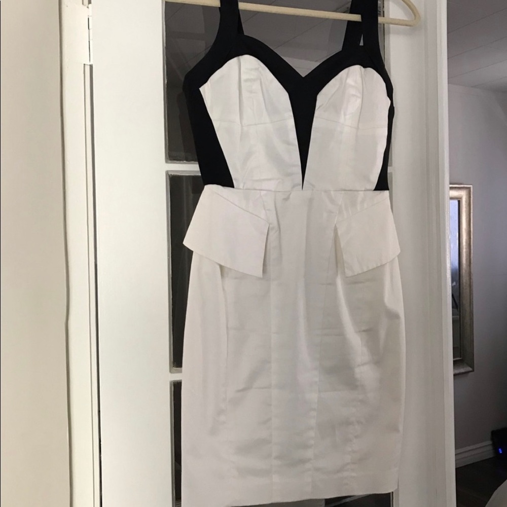 Bebe black and white peplum dress. New with Tags!